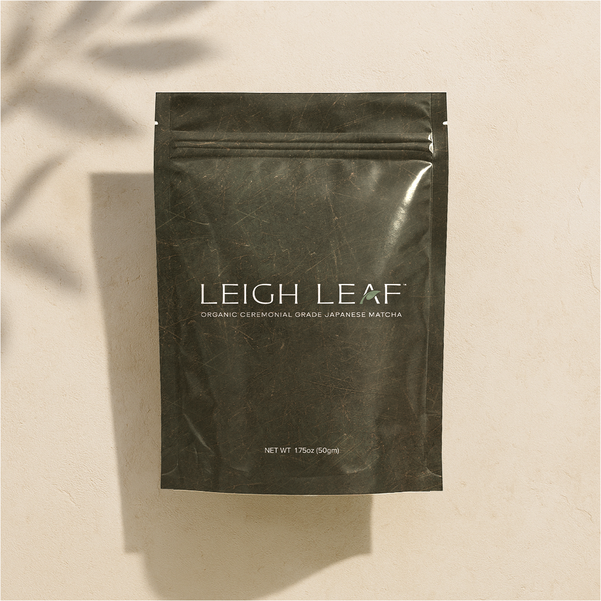 A close-up of the smooth texture and vibrant green color of Premium Organic Ceremonial Grade Matcha - 50g Bag from Leigh Leaf, perfect for tea ceremonies and health benefits.