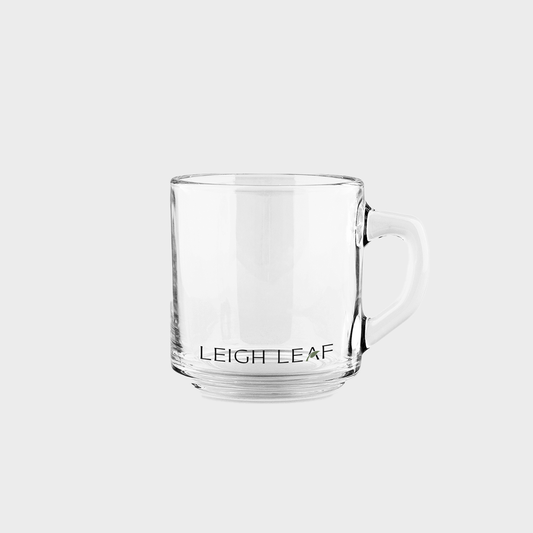 Clear glass mug with 'LEIGHLEAF' branding on a white background